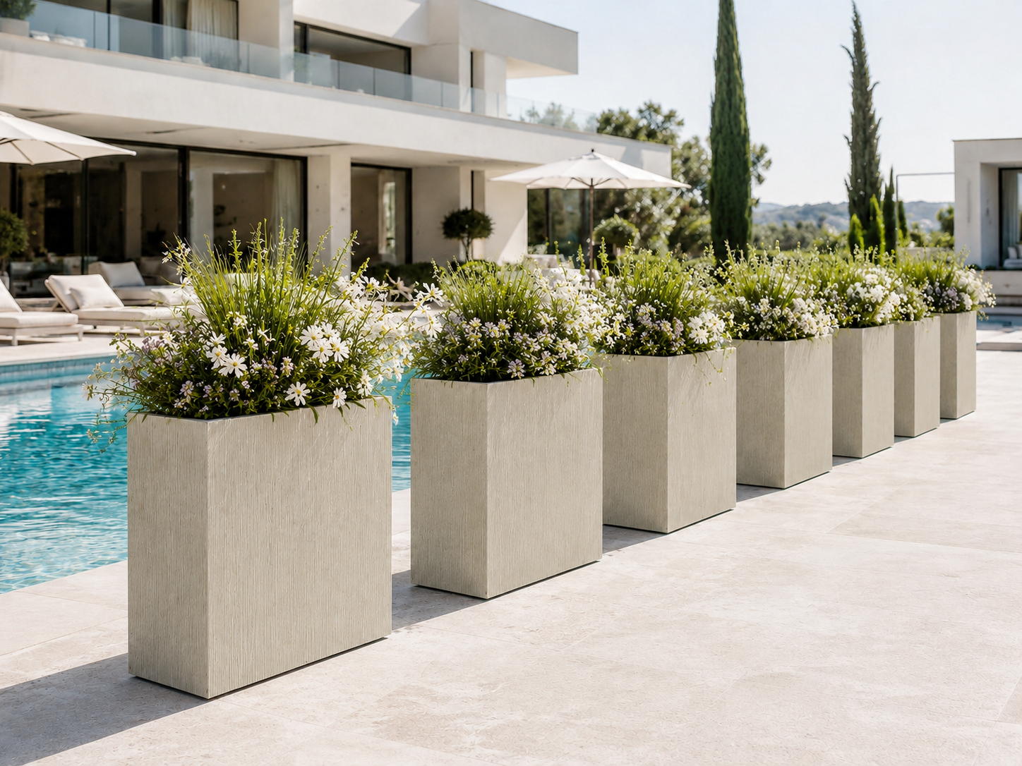 Line texture divider planters beside pool