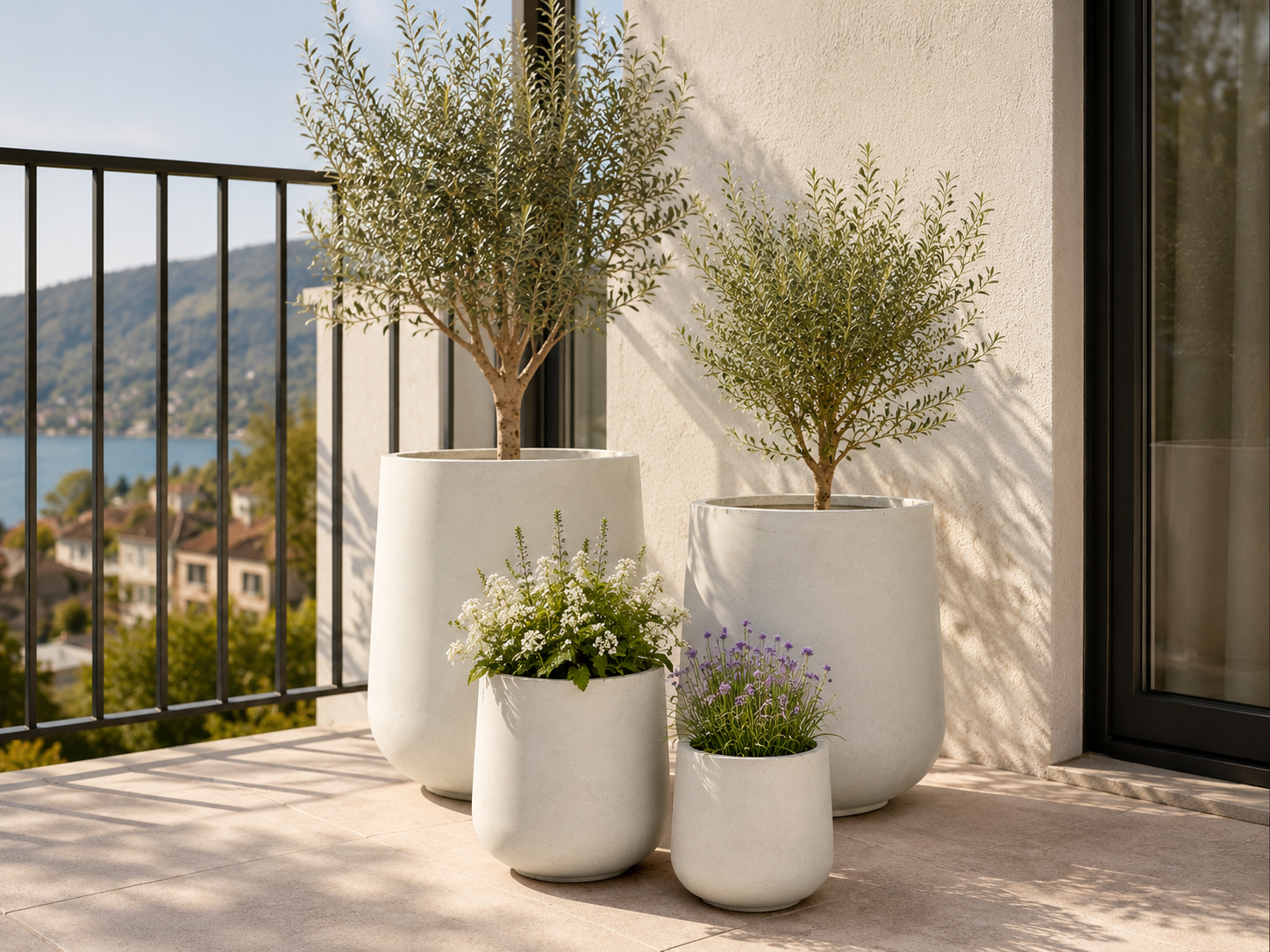 Single matte black round fibre clay planter for outdoor patio