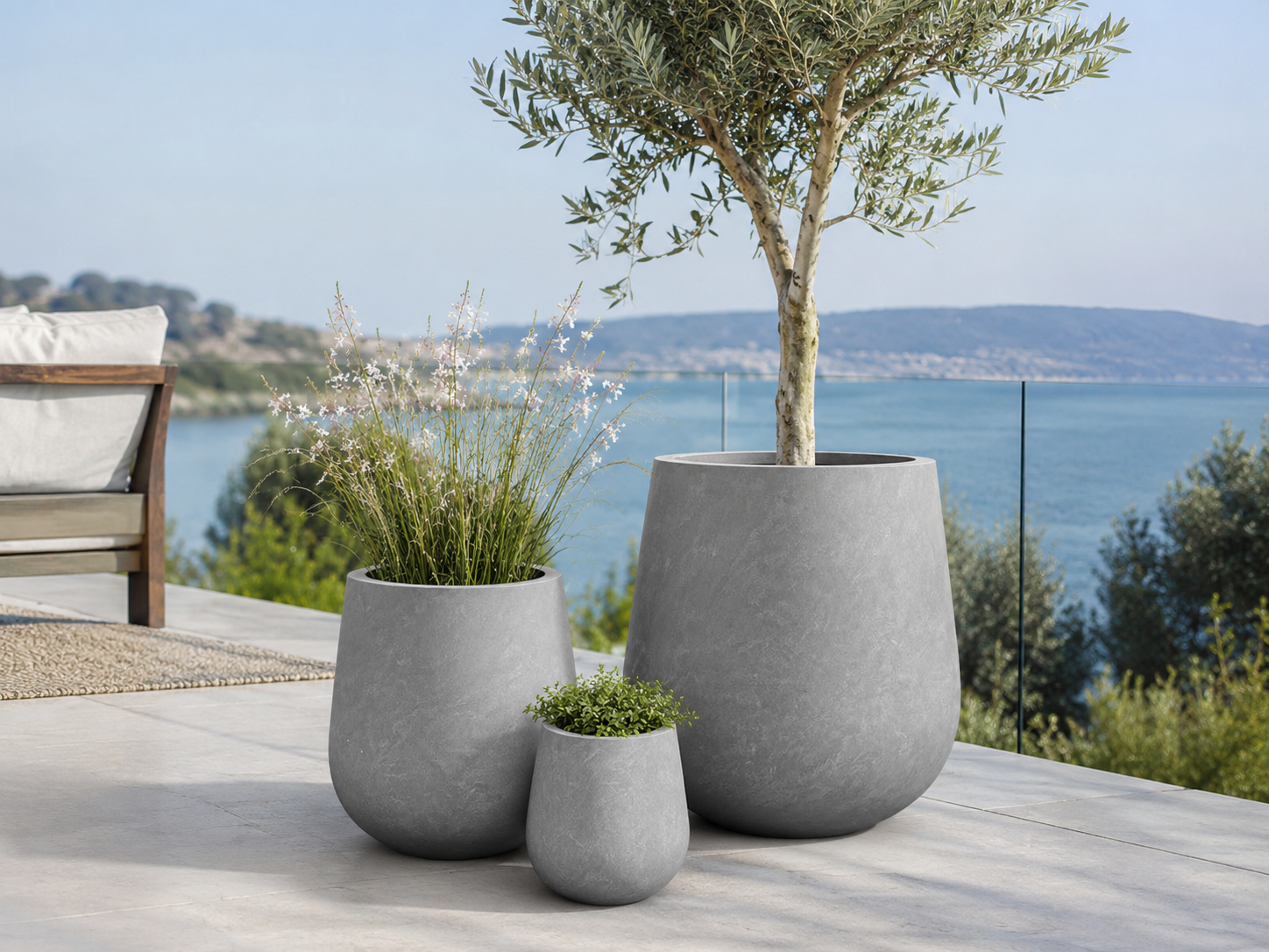 Smooth grey <a href=/products.html target='_blank'>fiber clay planter pots</a> for Mediterranean patio