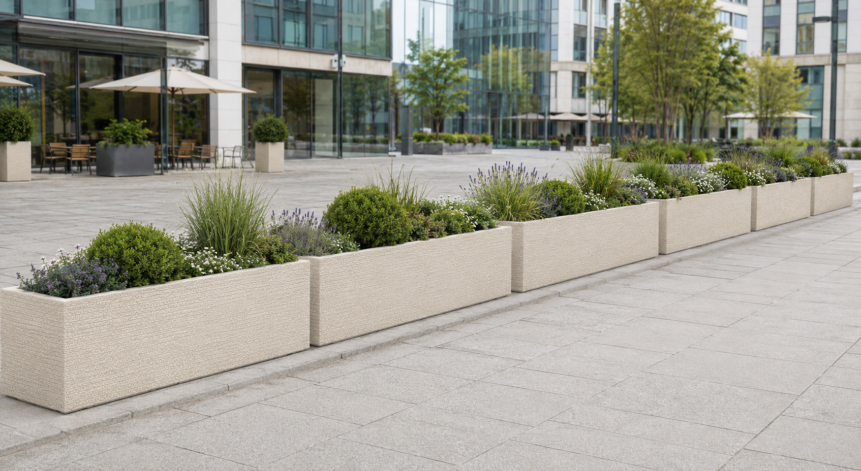 Large smooth white trough planters for hotel arcade and covered walkway landscaping