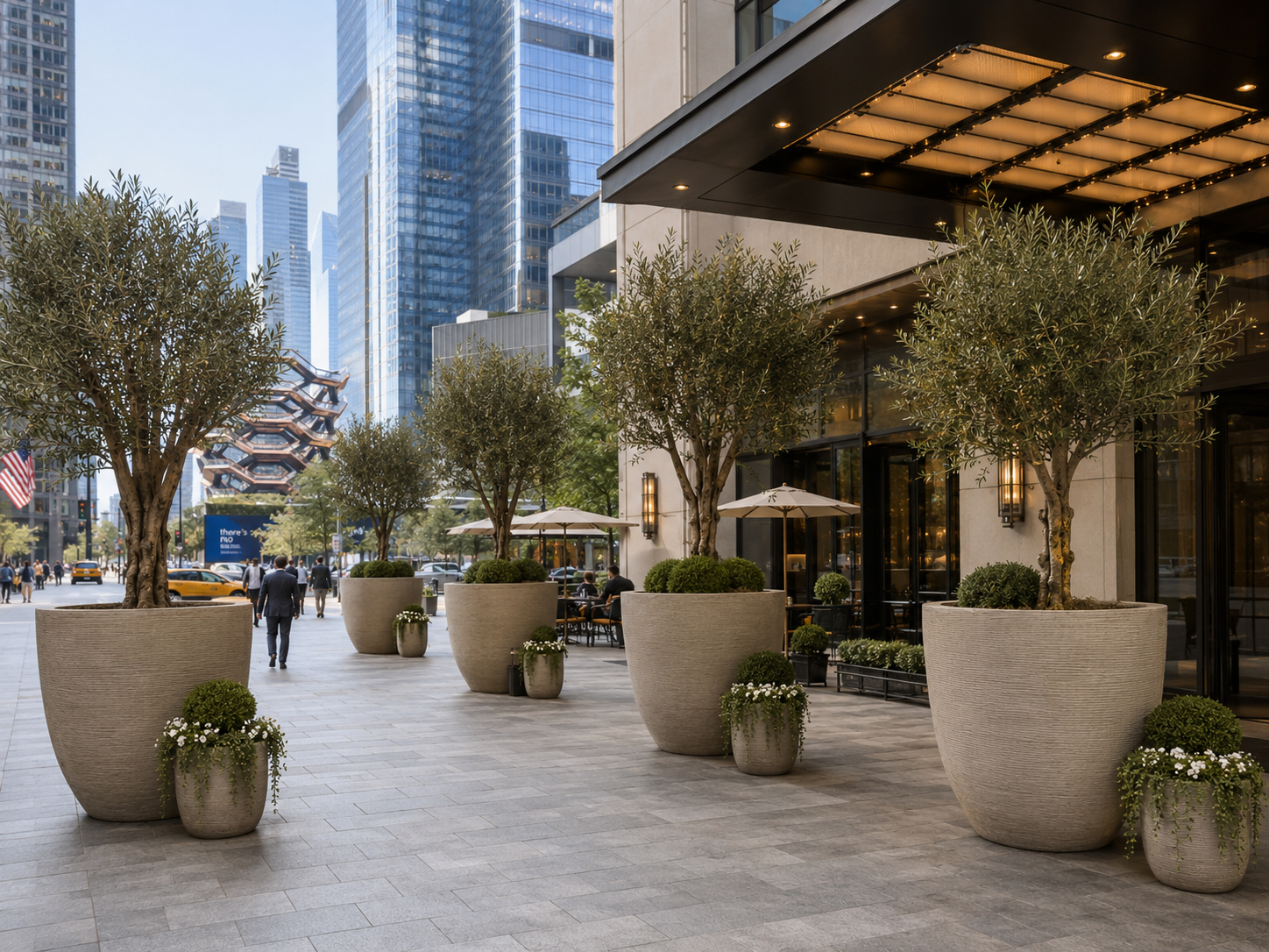 Large beige fiberclay planter pots for commercial walkway landscape