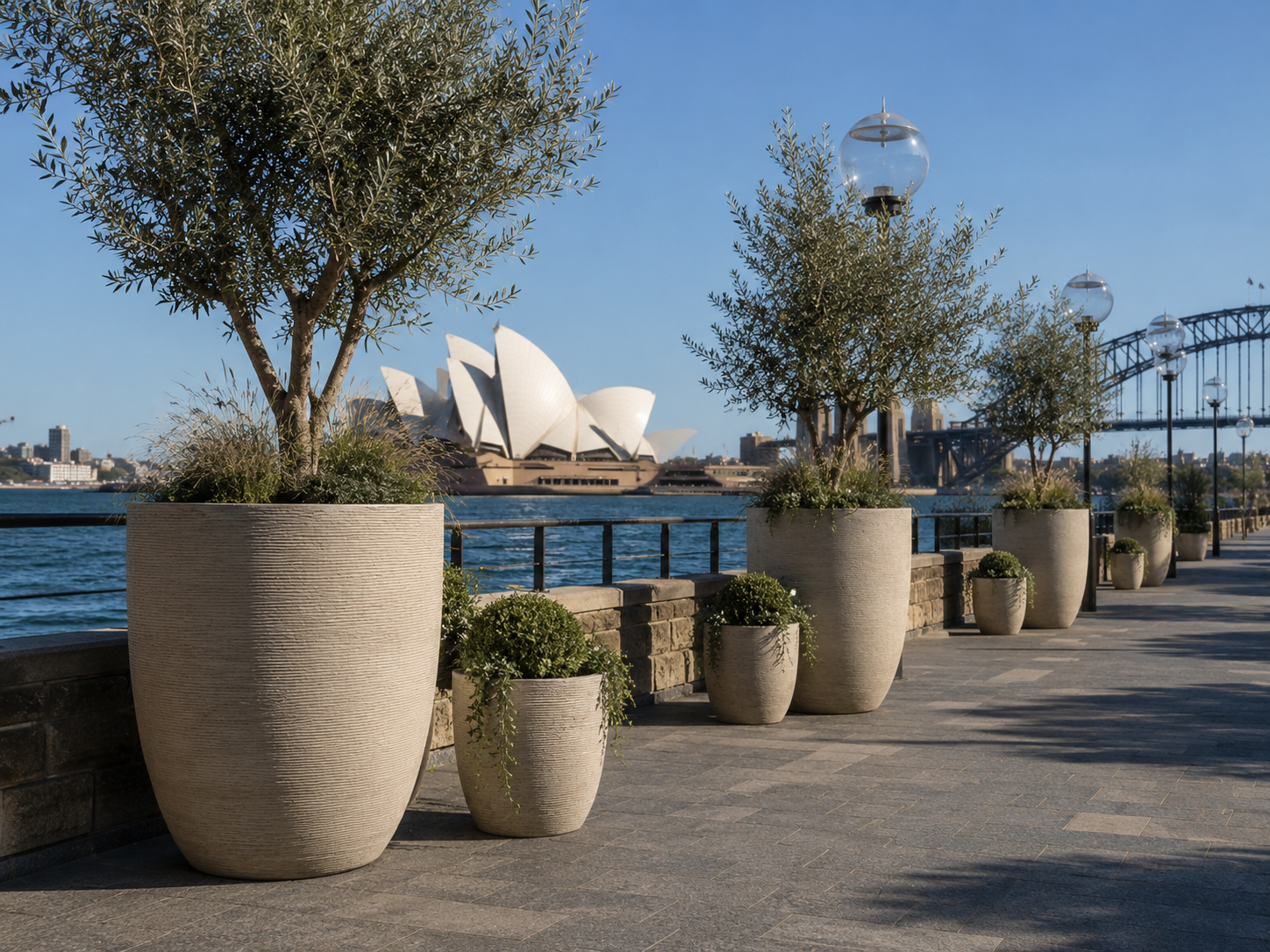 Large fibre clay planter pots for waterfront landscape project