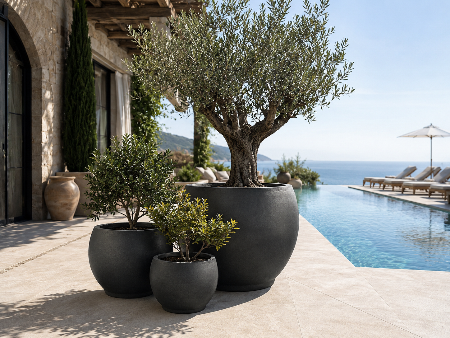 Weather resistant smooth black fiber clay pots for poolside project